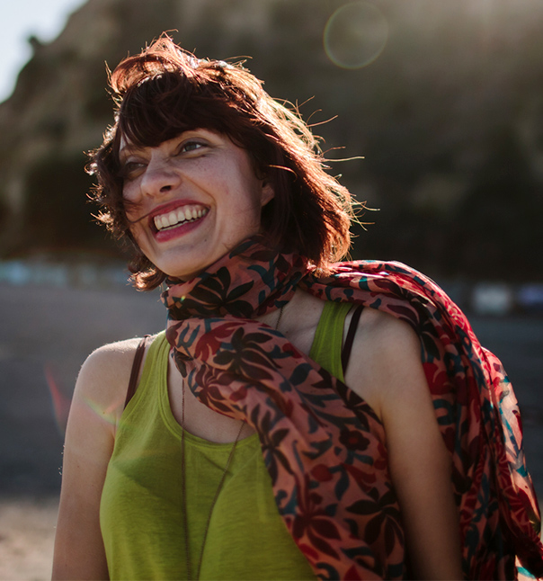 woman with a scarf smiling