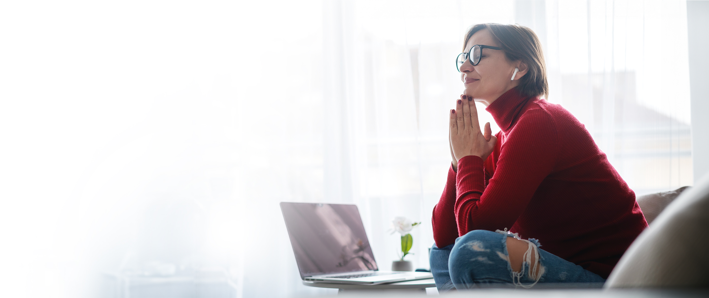 women looking at her laptop